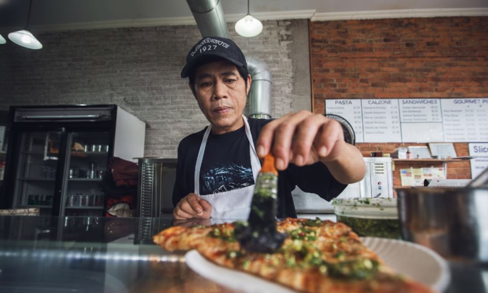 Chef preparing pizza